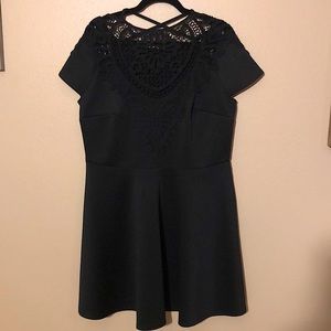 Black cocktail dress with lace detail on front